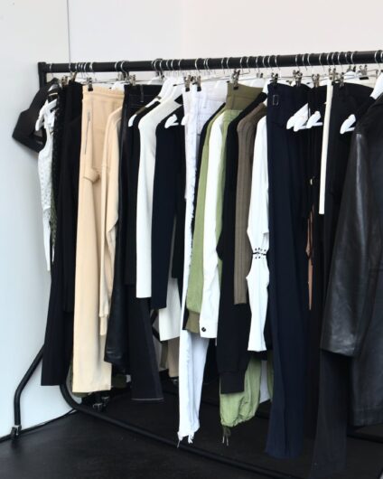 collection of garments hanging on rack