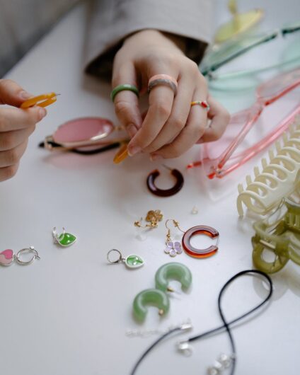 woman making handmade pendants